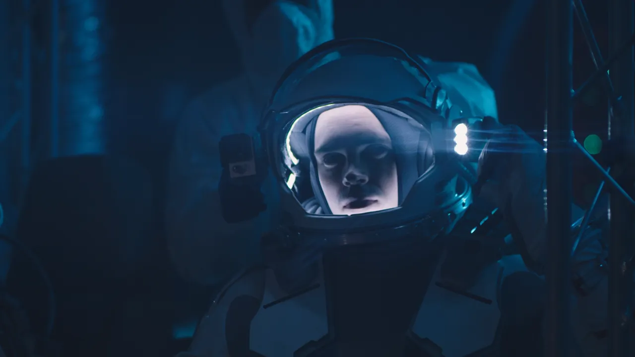 A video embedded on a studio's site: an astronaut seated in a training suit